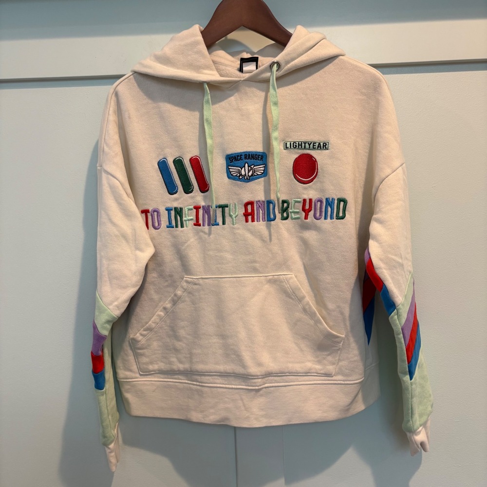 Pixar Our Universe Hoodie XS Cream Buzz Lightyear To Infinity Beyond Rainbow